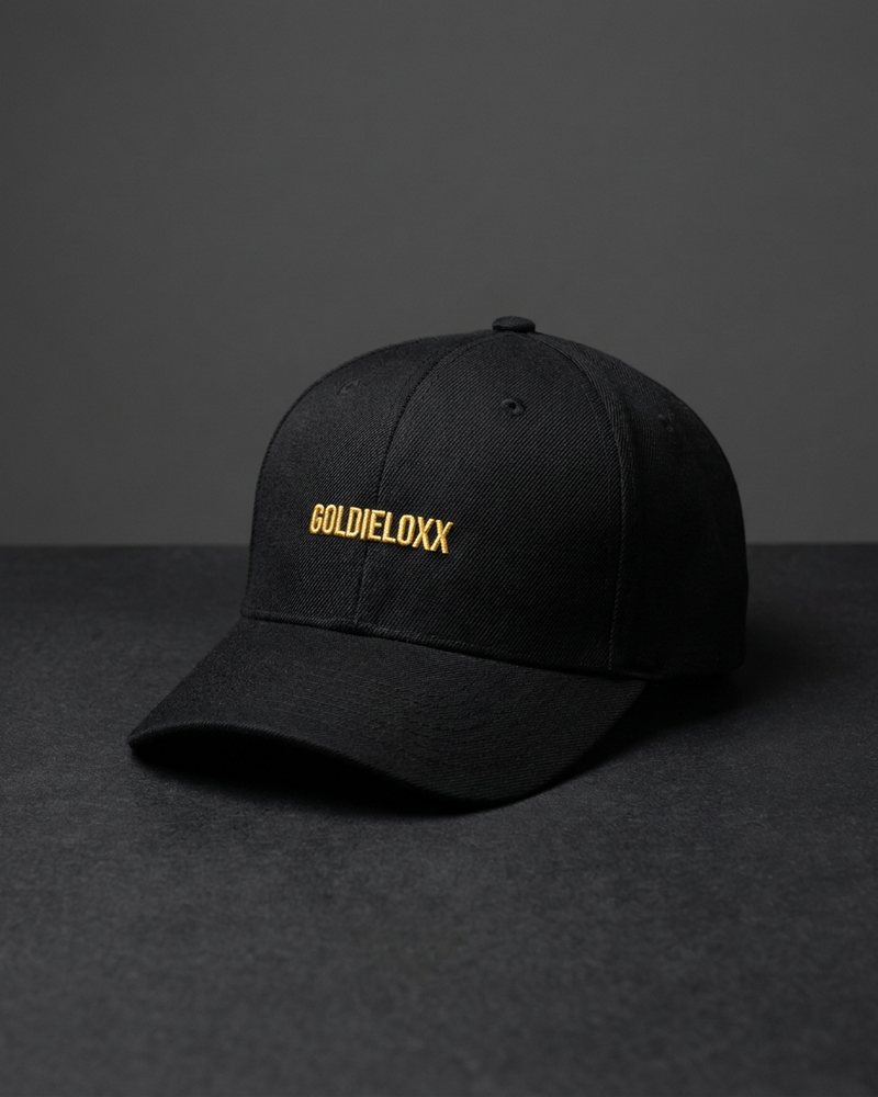 Concept mockup: black cap with gold GoldieLoxx embroidery